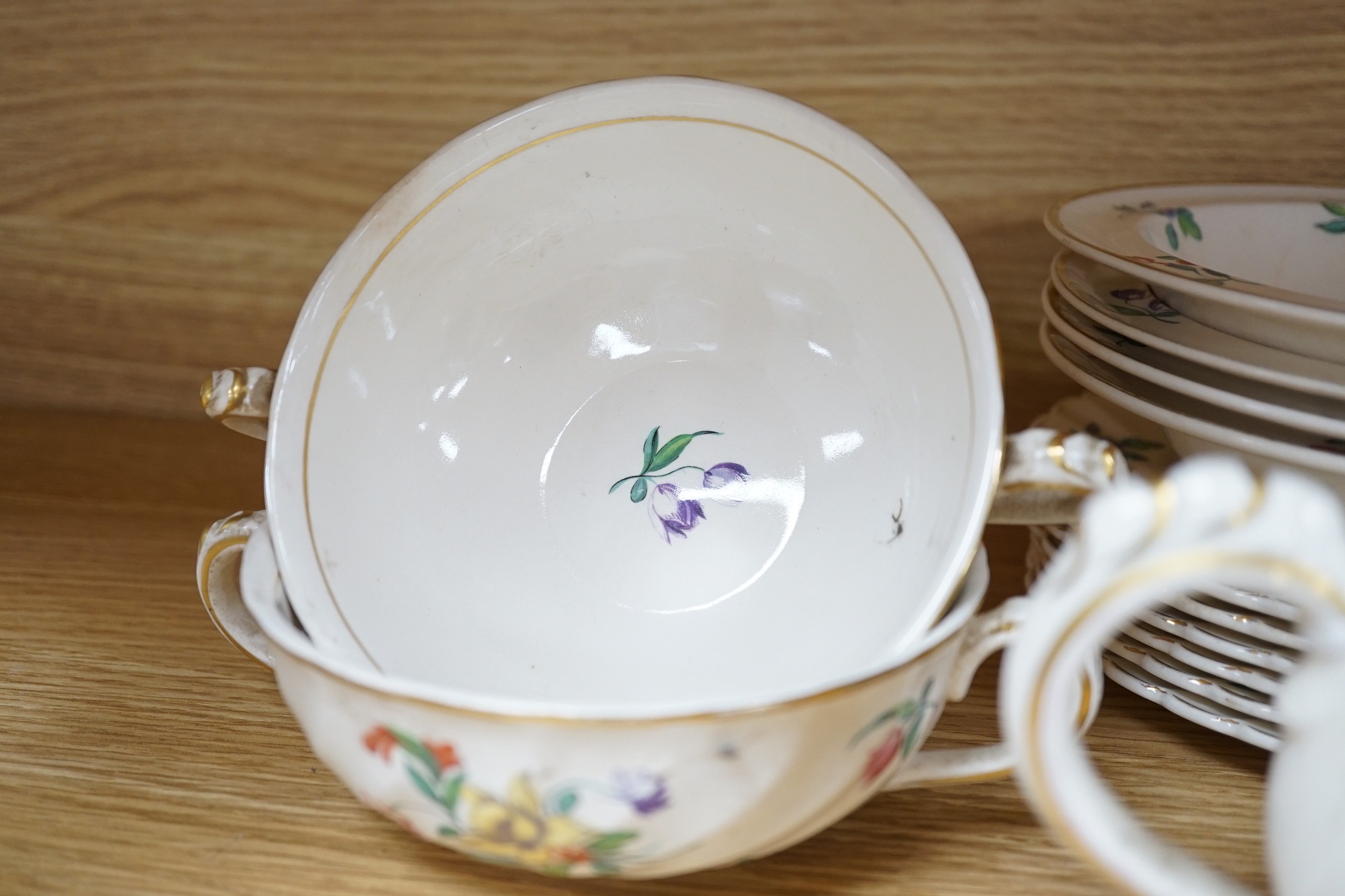 A part Clarice Cliff dinner set. With soup bowls, gravy bowl, etc. with flower decoration